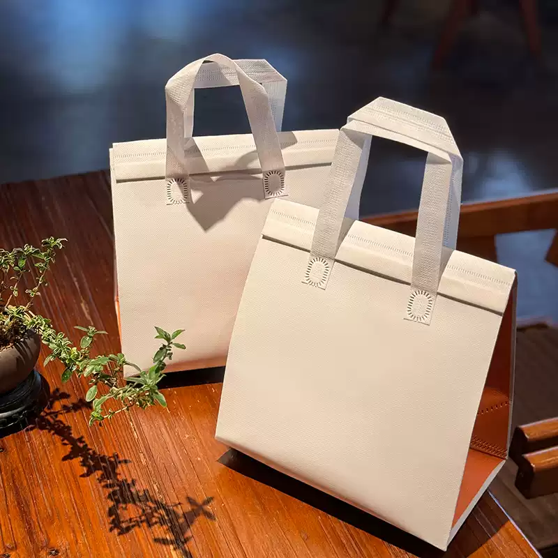 100 TÚI GIỮ NHIỆT TRƠN - MÀU TRẮNG CẠNH CAM (Giá của 100 túi)